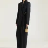 Broek met split en dubbele plooi van wol Broek met split en dubbele plooi van wol