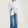 Middelblauwe jeans met omgeslagen pijpen Middelblauwe jeans met omgeslagen pijpen