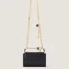 Pout-tasje van leer met Lucky Charms-ketting Pout-tasje van leer met Lucky Charms-ketting