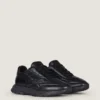 Sneakers van glanzend gewatteerd leer