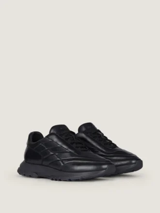 Sneakers van glanzend gewatteerd leer
